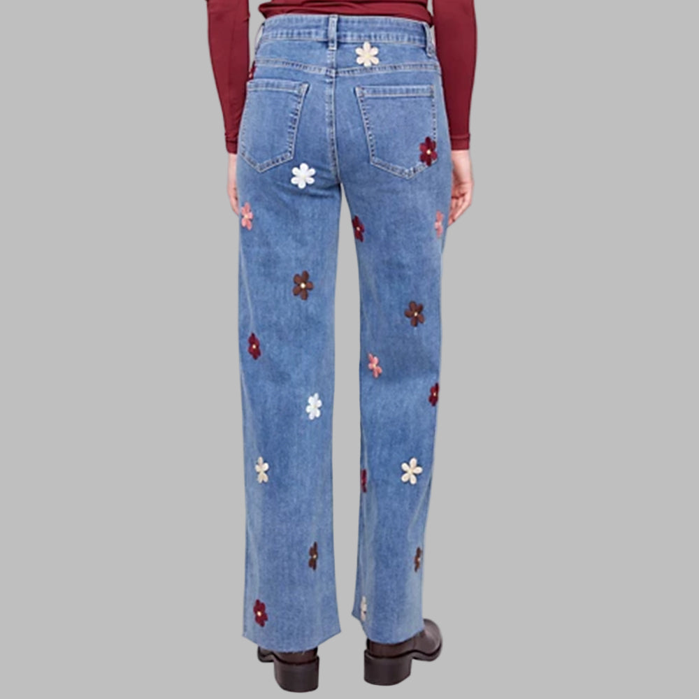 Blue jeans with floral embroidery on a white background