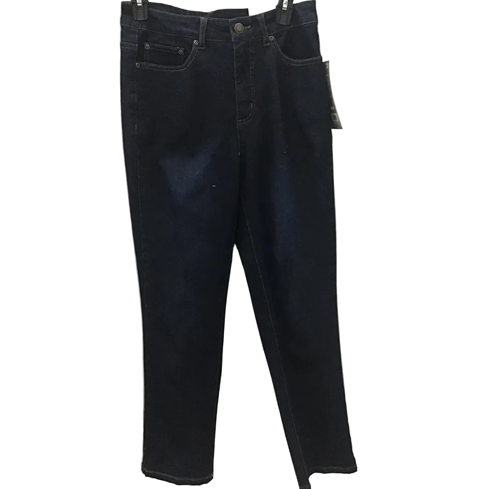 Dark wash blue jeans hanging on a hanger against a white paneled wall with patterned lace curtains on both sides.