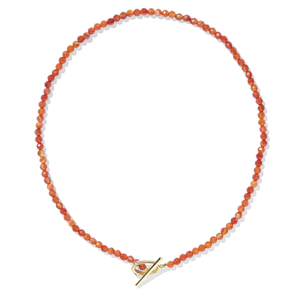 Necklace with orange beads and a gold clasp on a white background