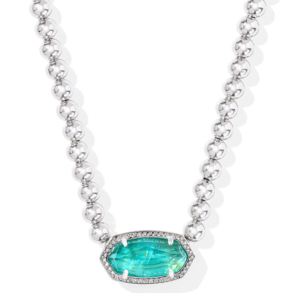 Necklace with a green gemstone pendant on a white background