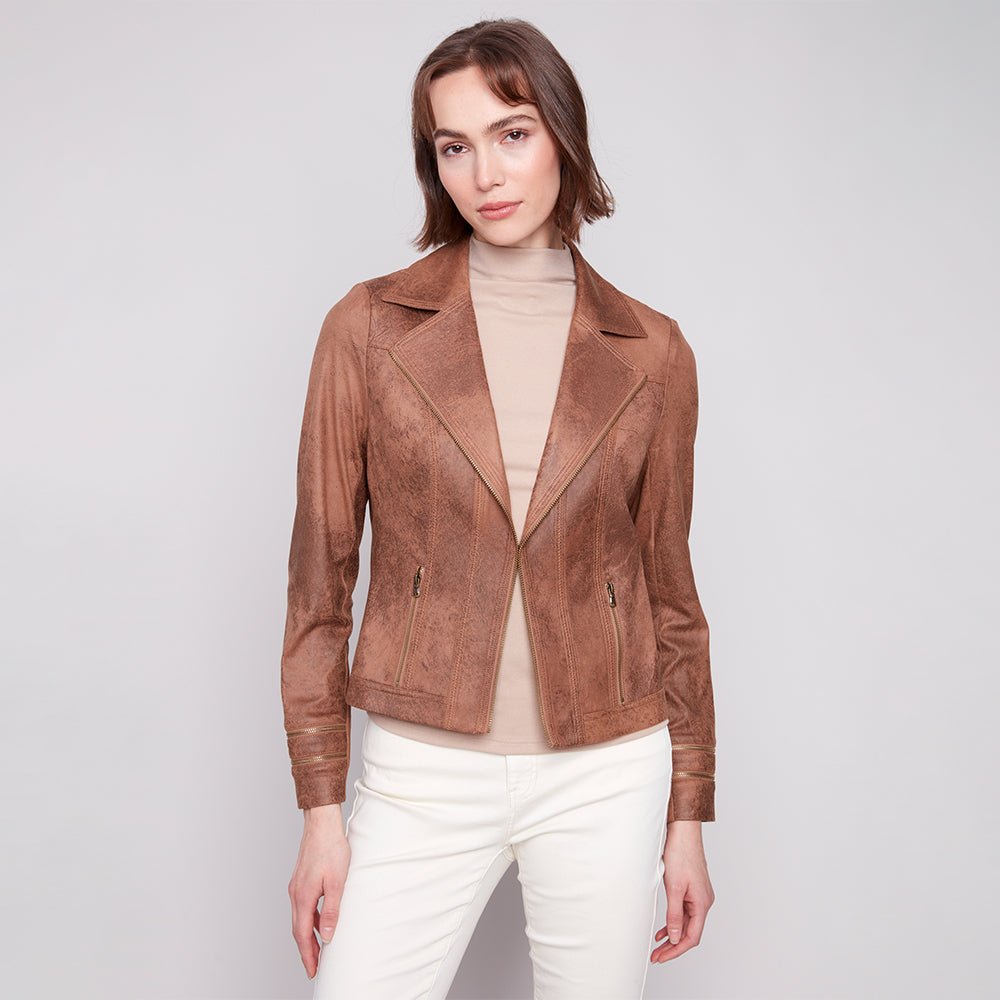 Woman wearing a brown leather jacket on a white background
