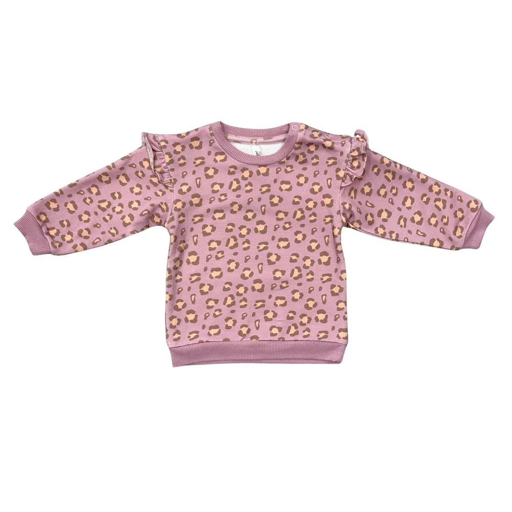 Pink sweater with gold leopard print on a white background