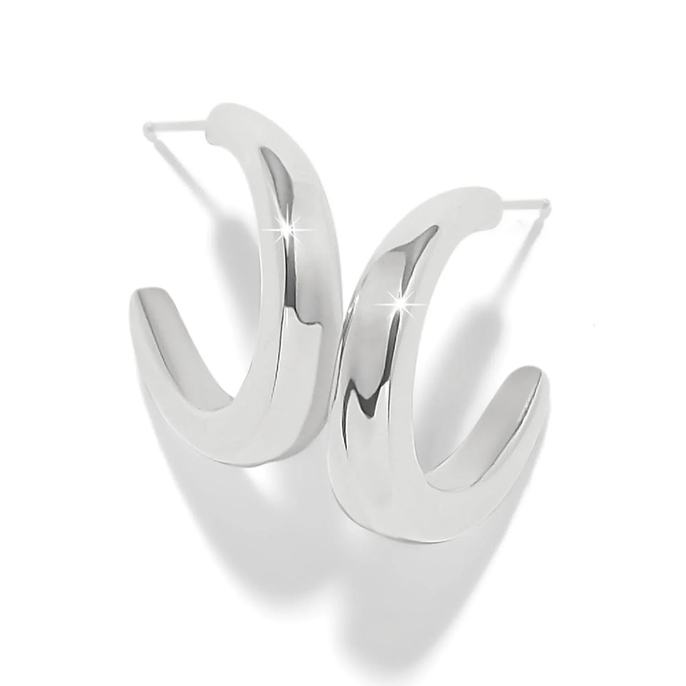 A pair of polished silver-toned hoop earrings with a modern, curved open design, displayed on a clean white background with soft shadows.