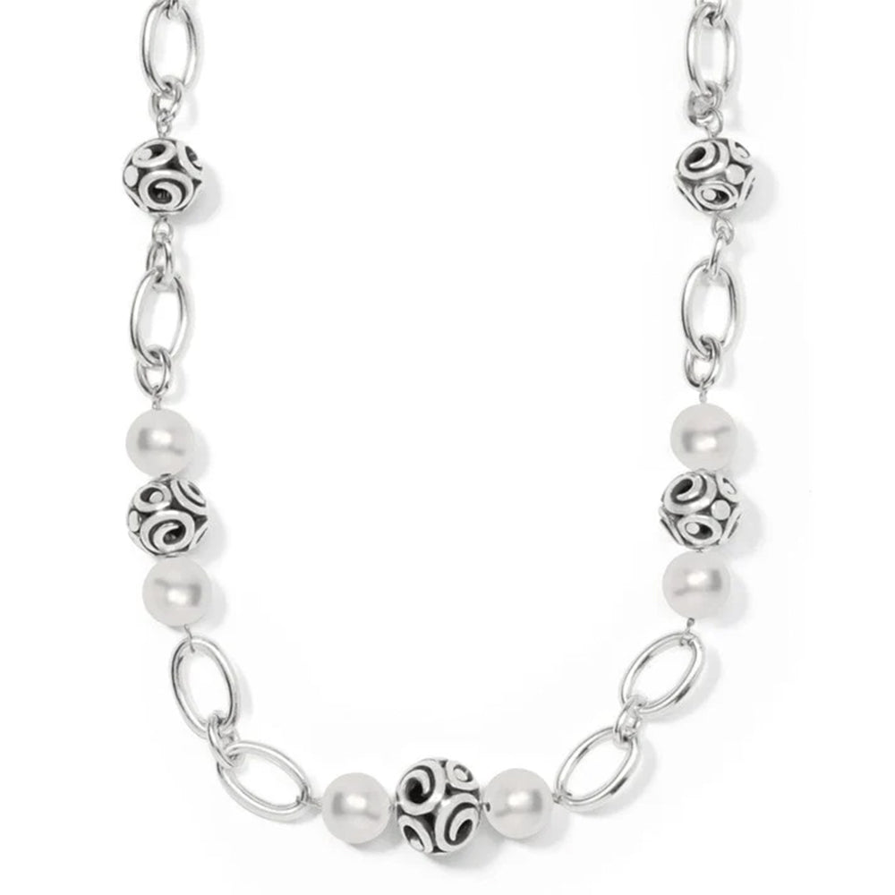 Silver chain necklace with pearl beads on a white background