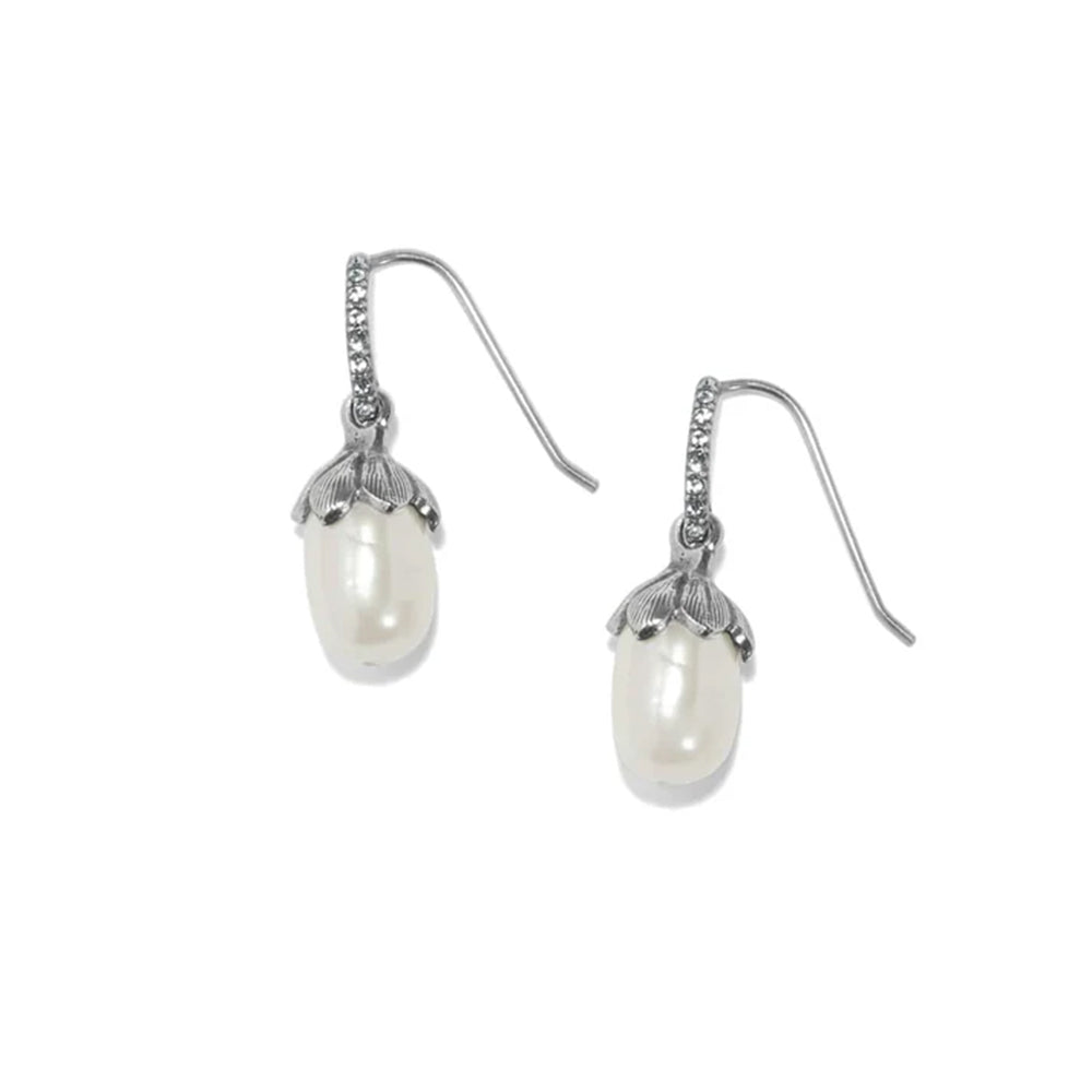 A pair of silver drop earrings featuring a white freshwater pearl set in a textured metal cap, with a small row of clear stones along the ear wires, shown on a plain white background.