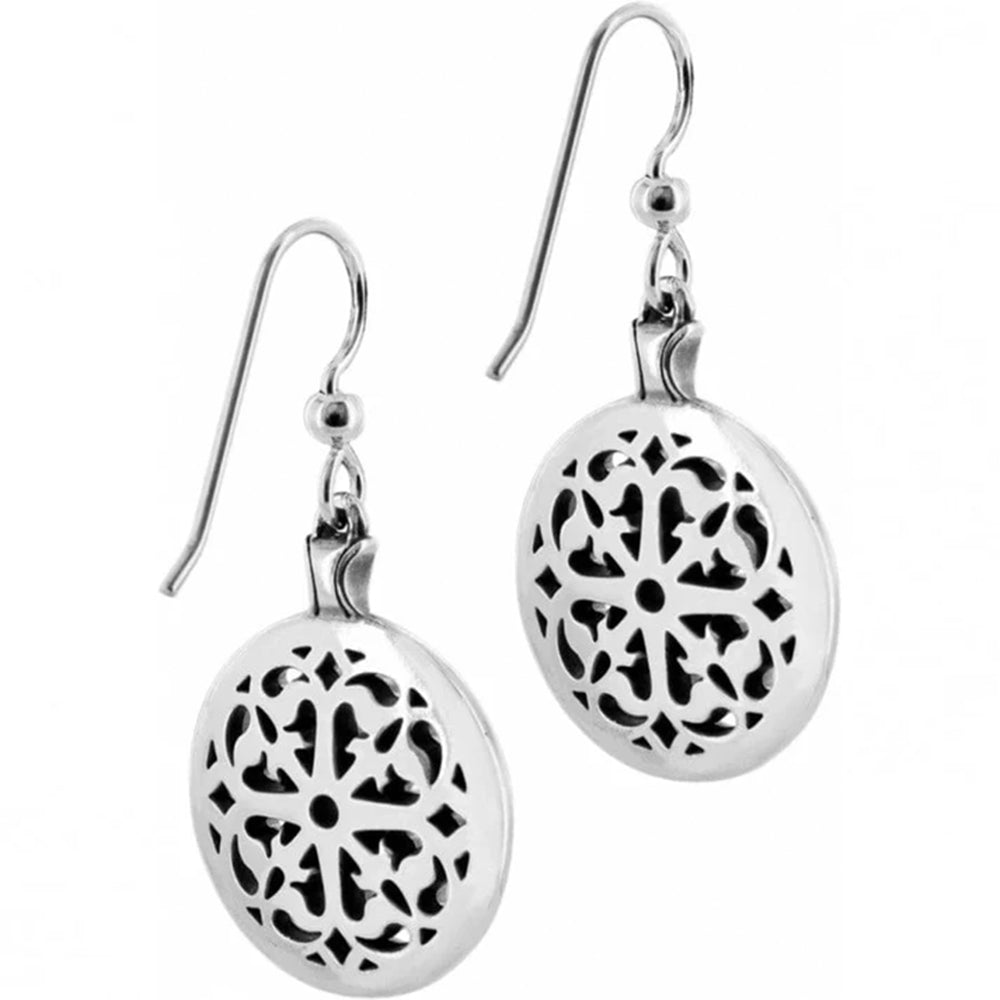 Silver earrings with intricate black patterns on a white background