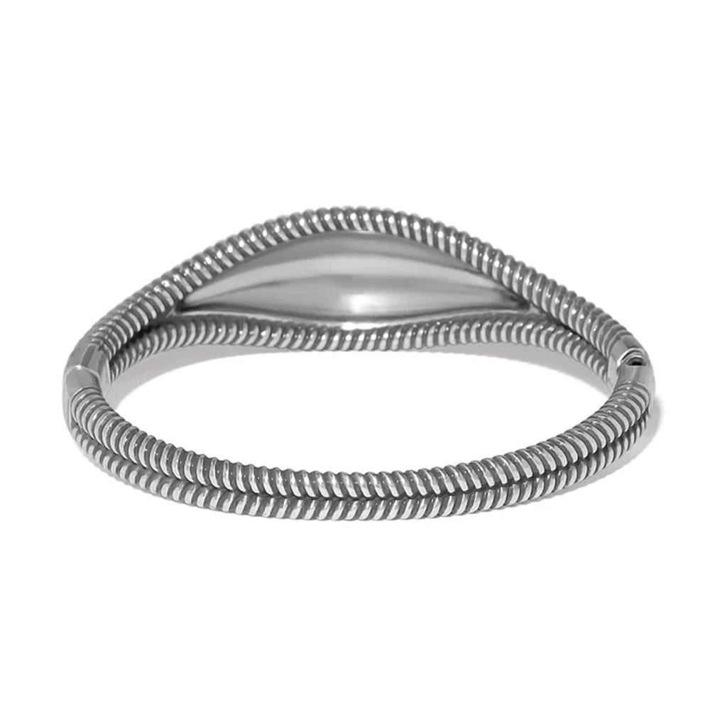 A silver-toned metal bangle bracelet with a textured, ribbed snake-style design and a smooth central inlay, shown on a plain white background.