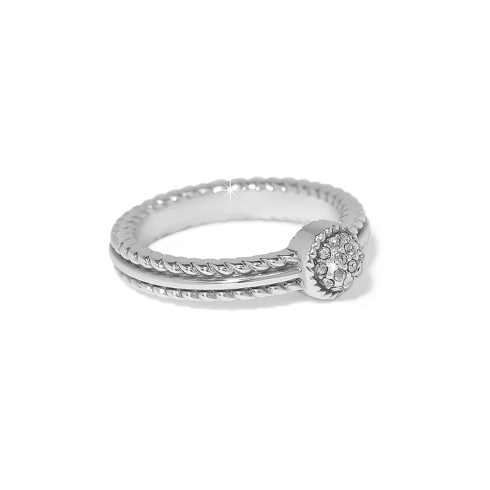 Silver ring with diamond accents on a white background