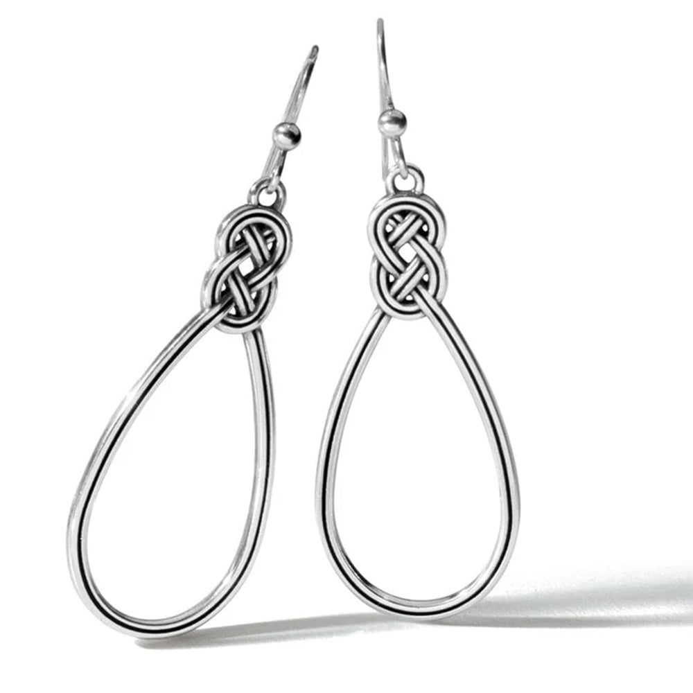 Silver teardrop earrings with Celtic knot design on a white background