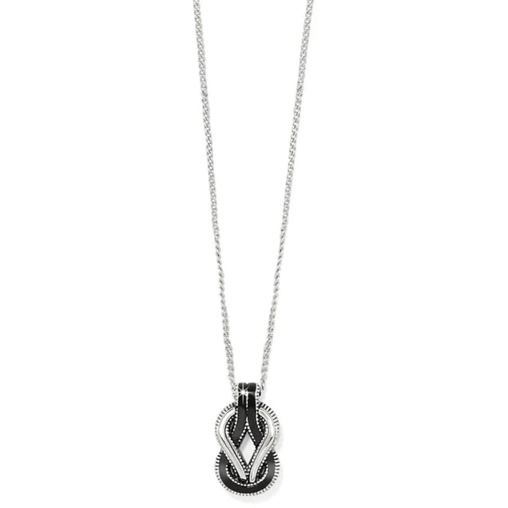 Necklace with a black and silver pendant on a white background