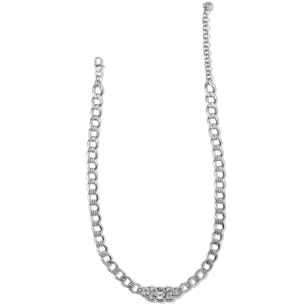 Silver chain necklace with a Celtic design on a white background