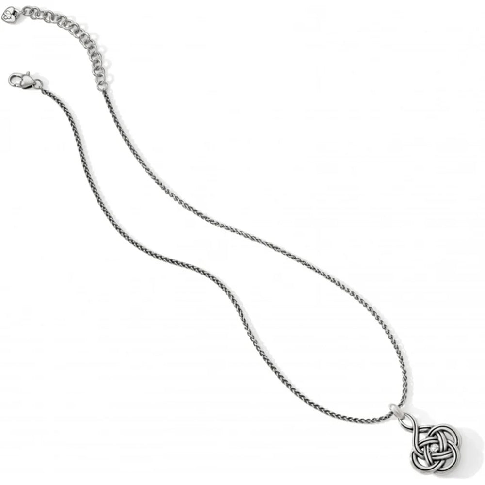 Silver necklace with a intricate pendant on a white background