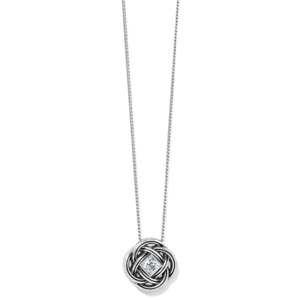 A silver necklace with a circular interwoven knot pendant featuring a small clear diamond at the center, shown against a plain white background.