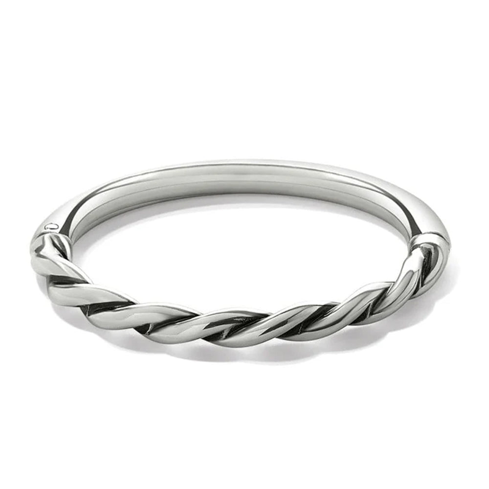 Silver twisted ring on a white background