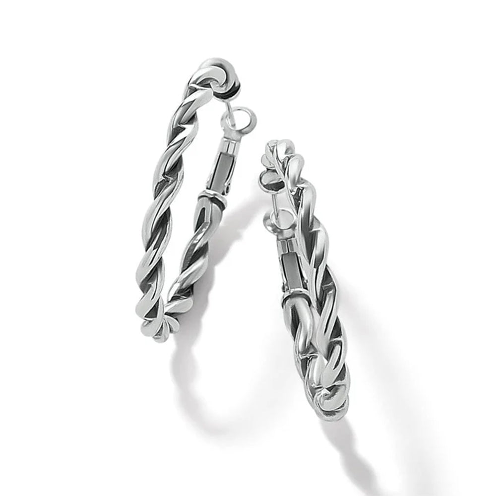 Pair of silver hoop earrings on a white background