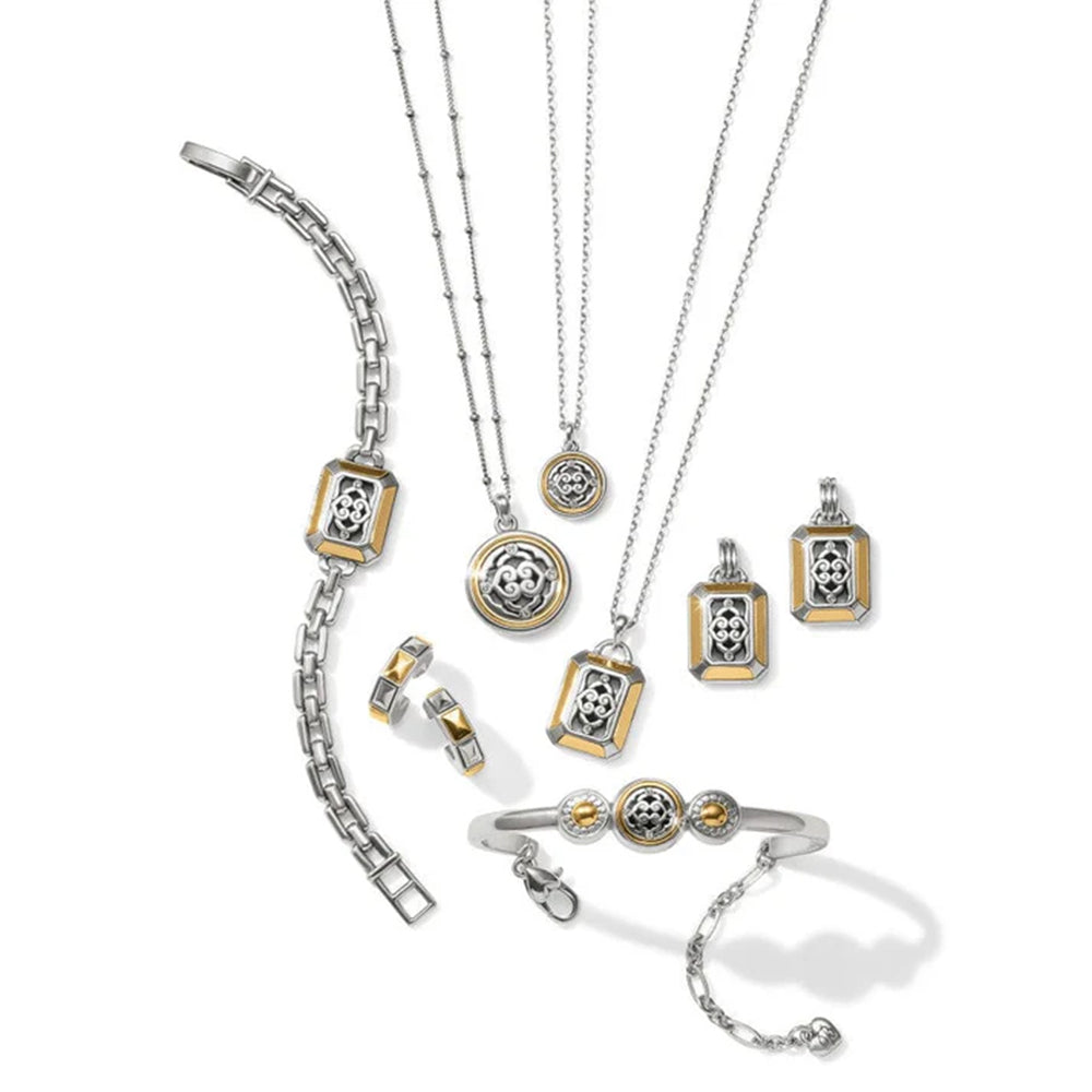 Collection of silver and gold jewelry including necklaces, pendants, and a bracelet on a white background.