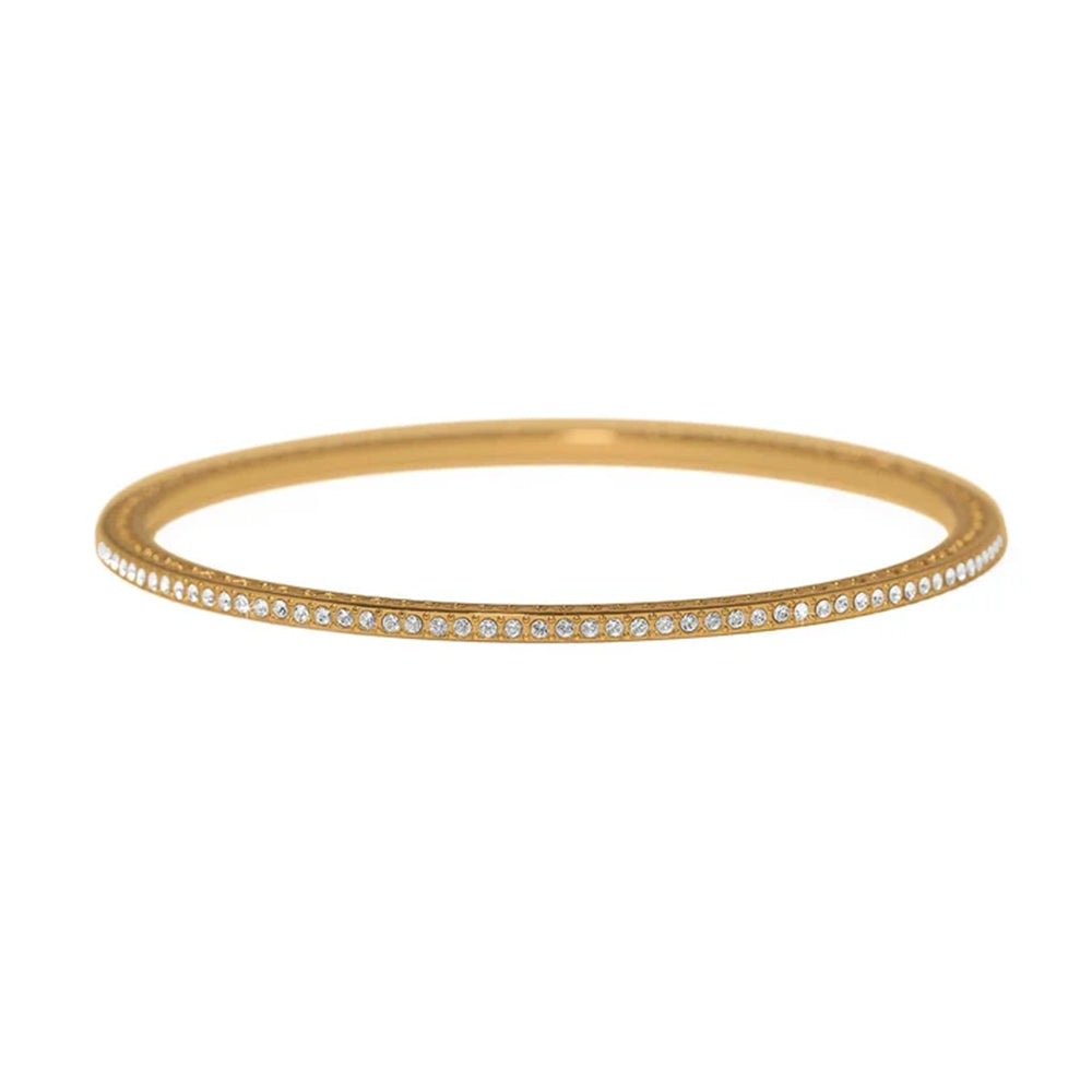 A thin gold bangle bracelet with a single row of small clear stones along the front edge, shown against a plain white background.