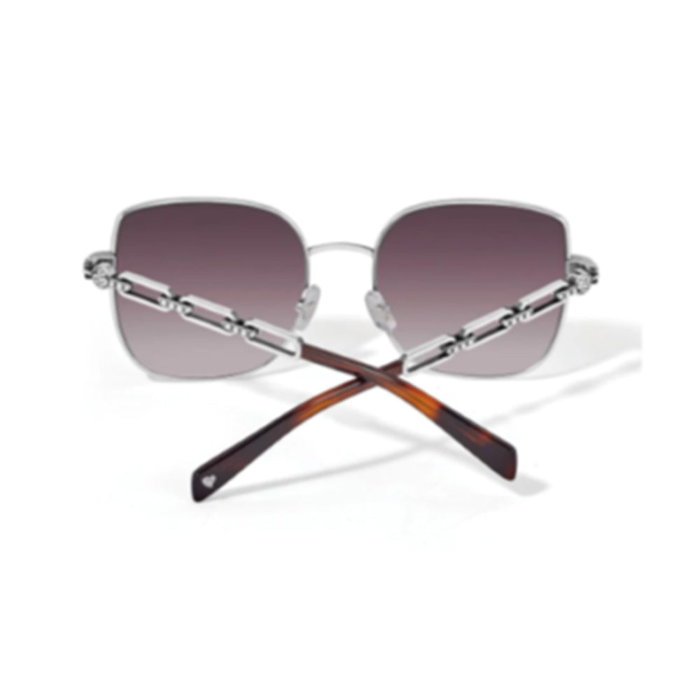 Sunglasses with gradient lenses and tortoiseshell arms on a white background