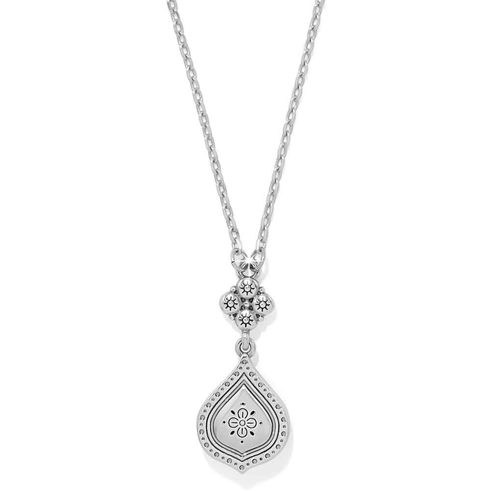 Silver necklace with a teardrop pendant on a white background