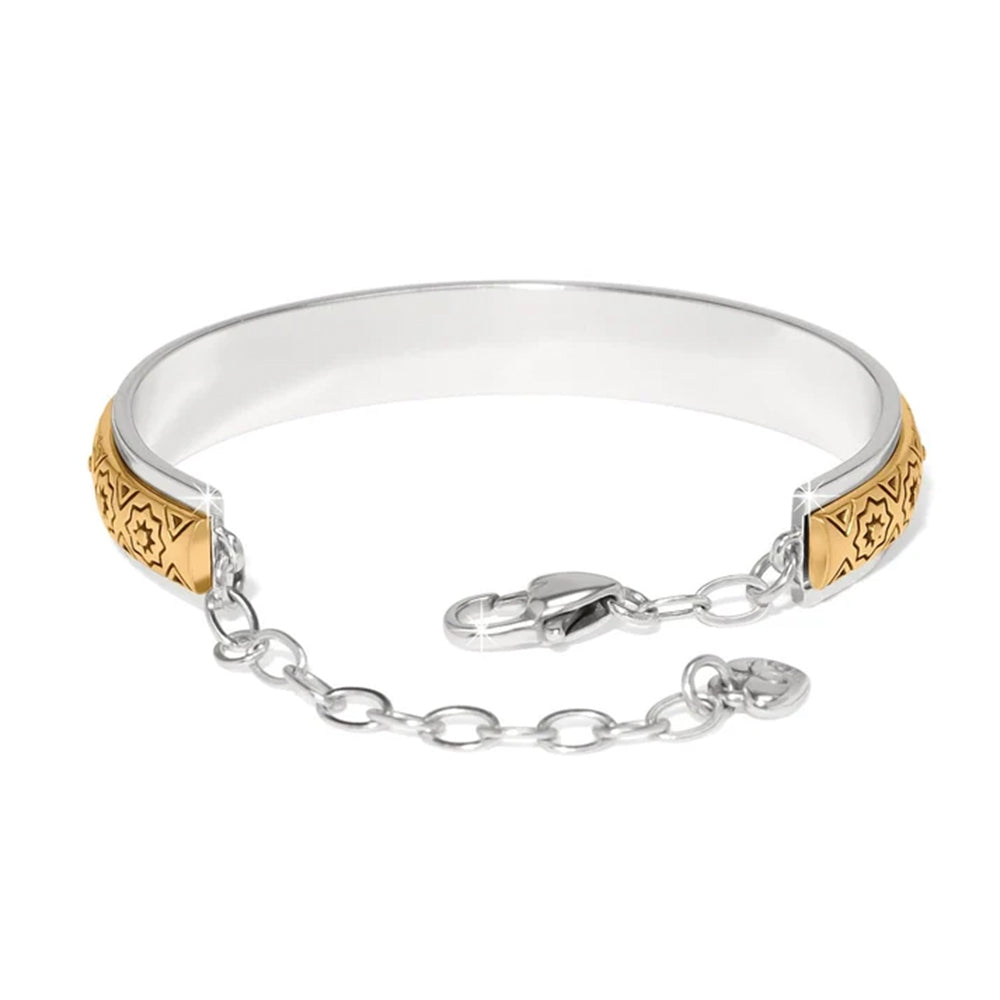 Silver and gold bracelet on a white background