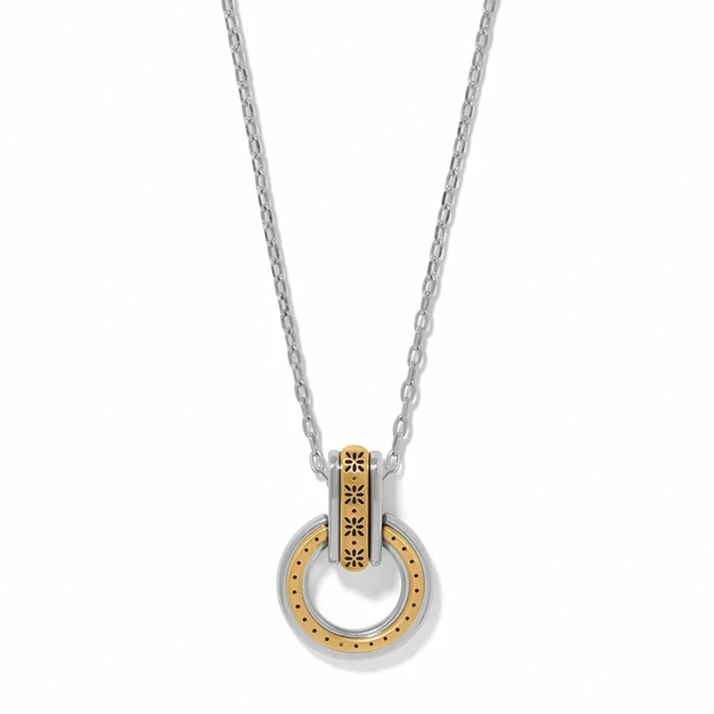 A silver and gold two-tone necklace featuring a circular pendant with a textured gold center and a silver outer ring, suspended from a delicate silver chain on a white background.