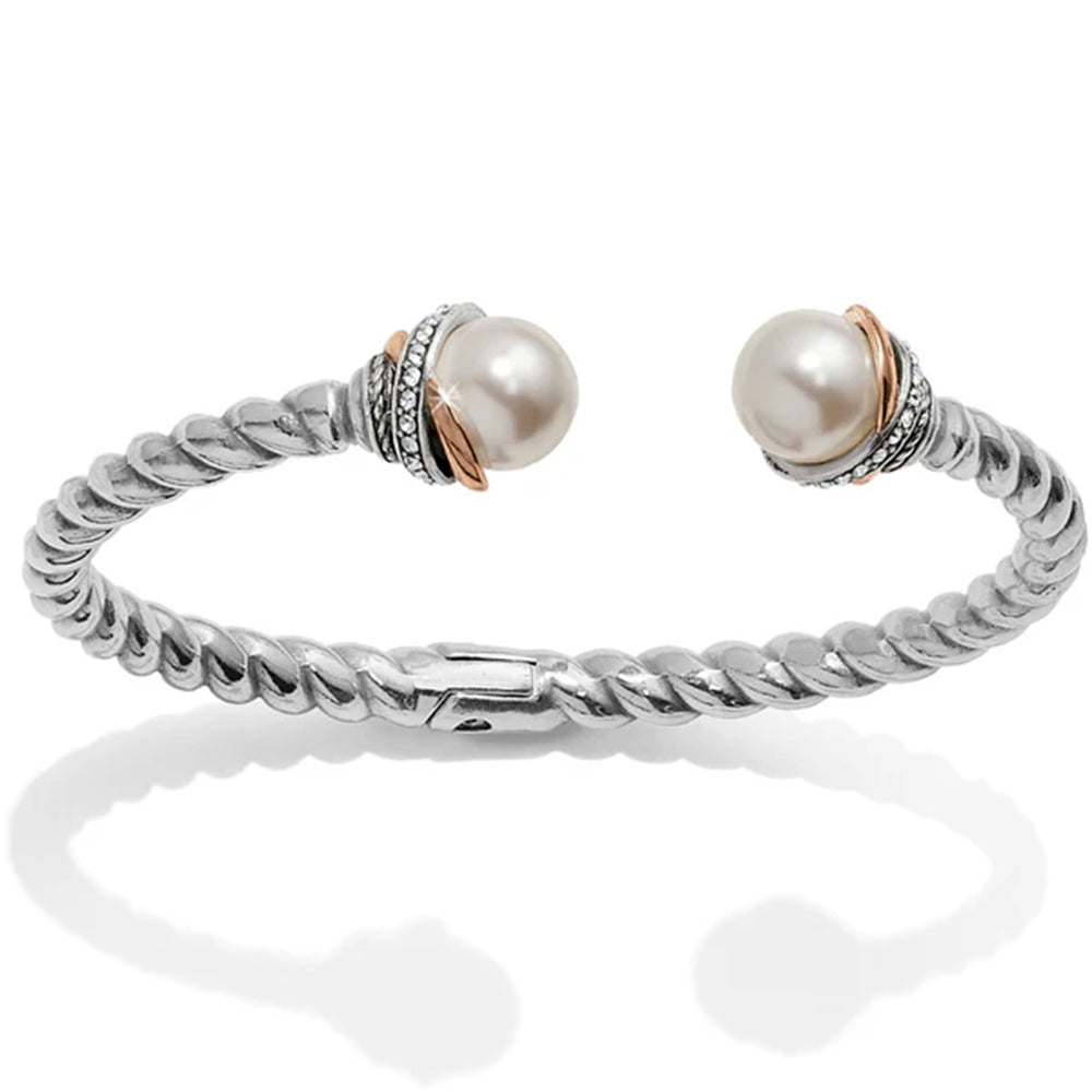 Silver bracelet with two pearls on a white background