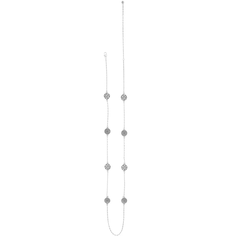 Long necklace with multiple small silver pendants on a white background