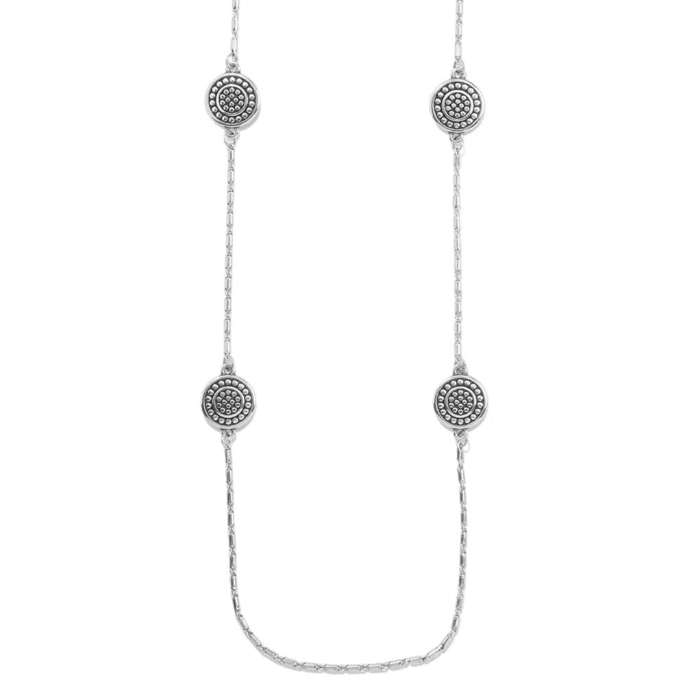 Silver necklace with circular pendant on a white background