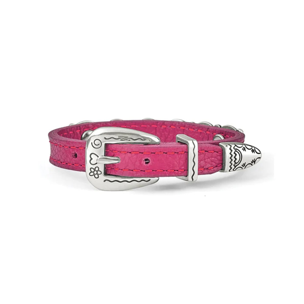 Pink bracelet with decorative metal plate on a white background