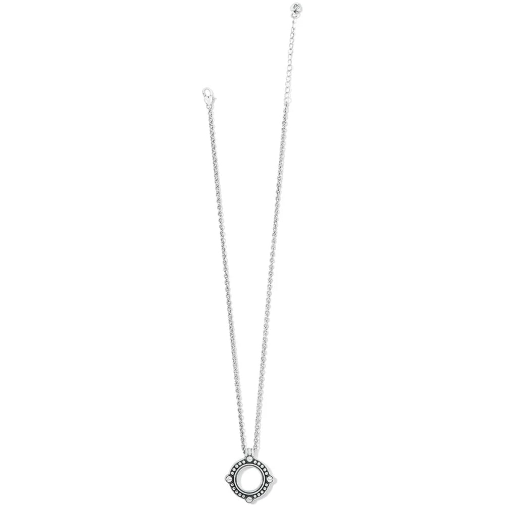 Silver necklace with a circular pendant on a white background