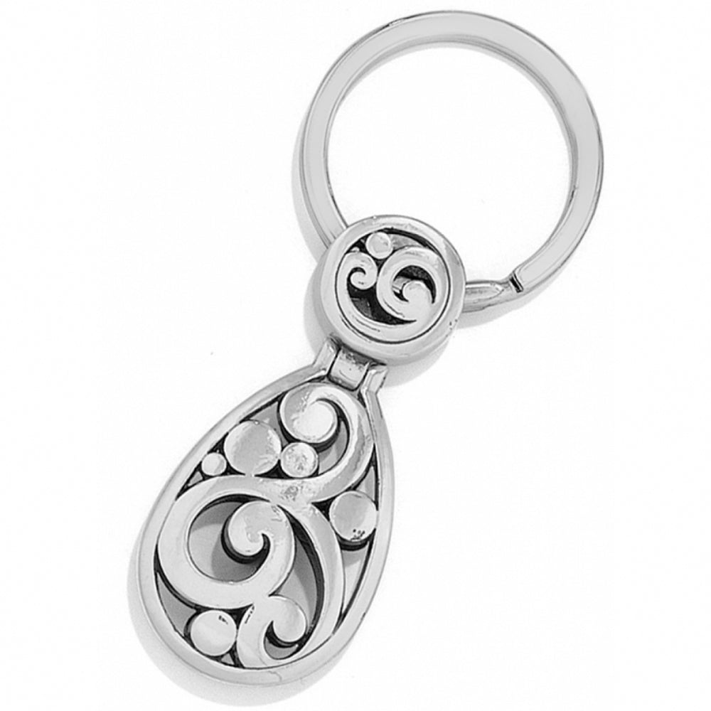 Silver keychain with intricate designs on a white background