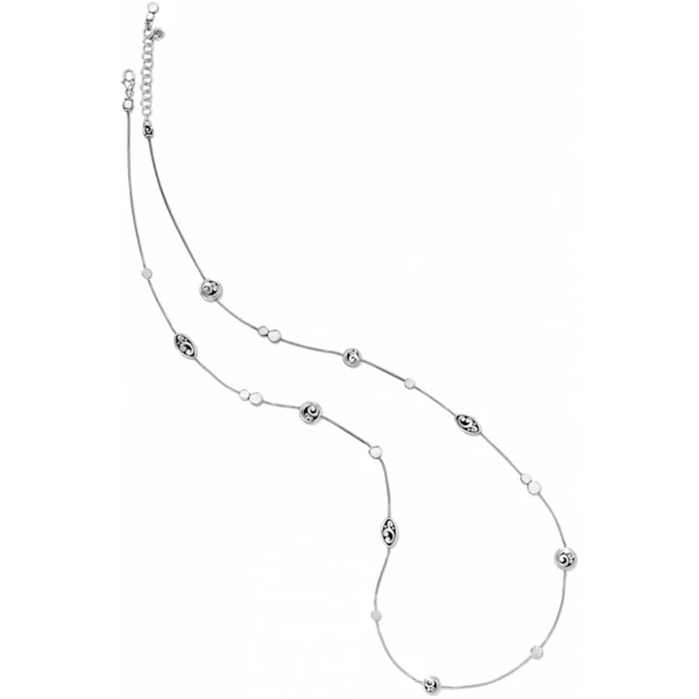 A delicate silver necklace featuring small, alternating polished and textured oval beads, displayed on a clean white background.