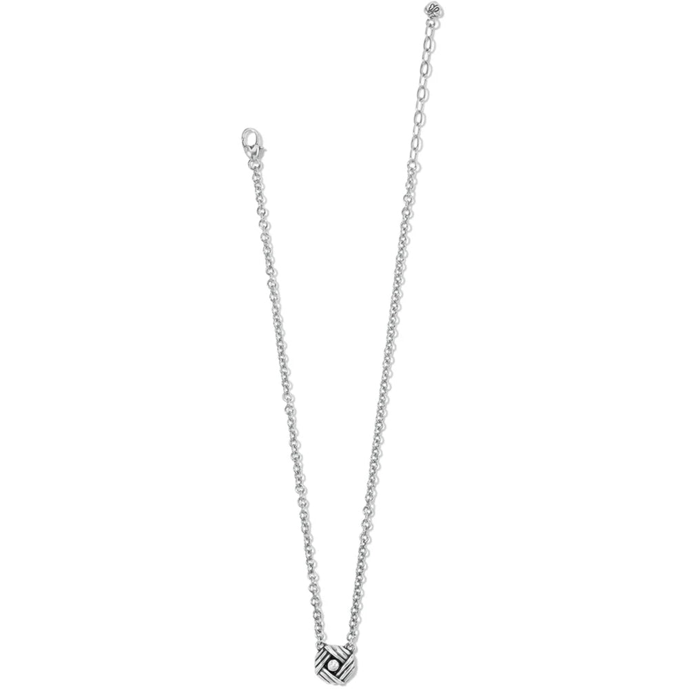 Silver necklace with a geometric pendant on a white background