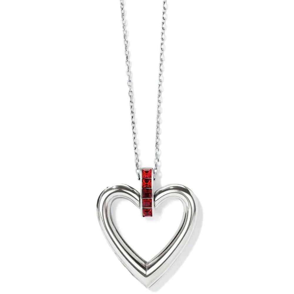 Heart-shaped pendant with red gemstone on a white background