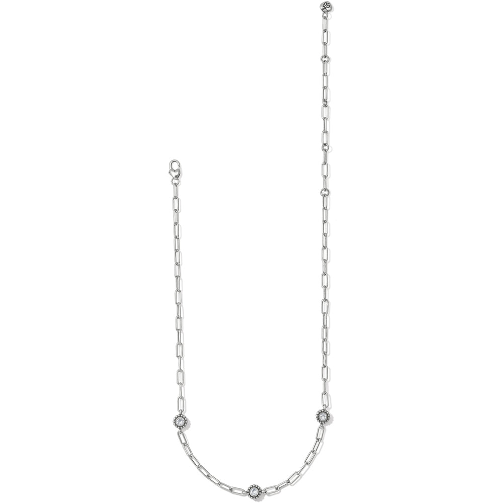 Silver chain necklace with small diamonds on a white background