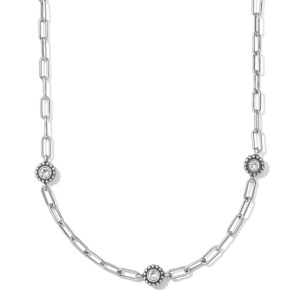 Silver chain necklace with diamond-like pendants on a white background