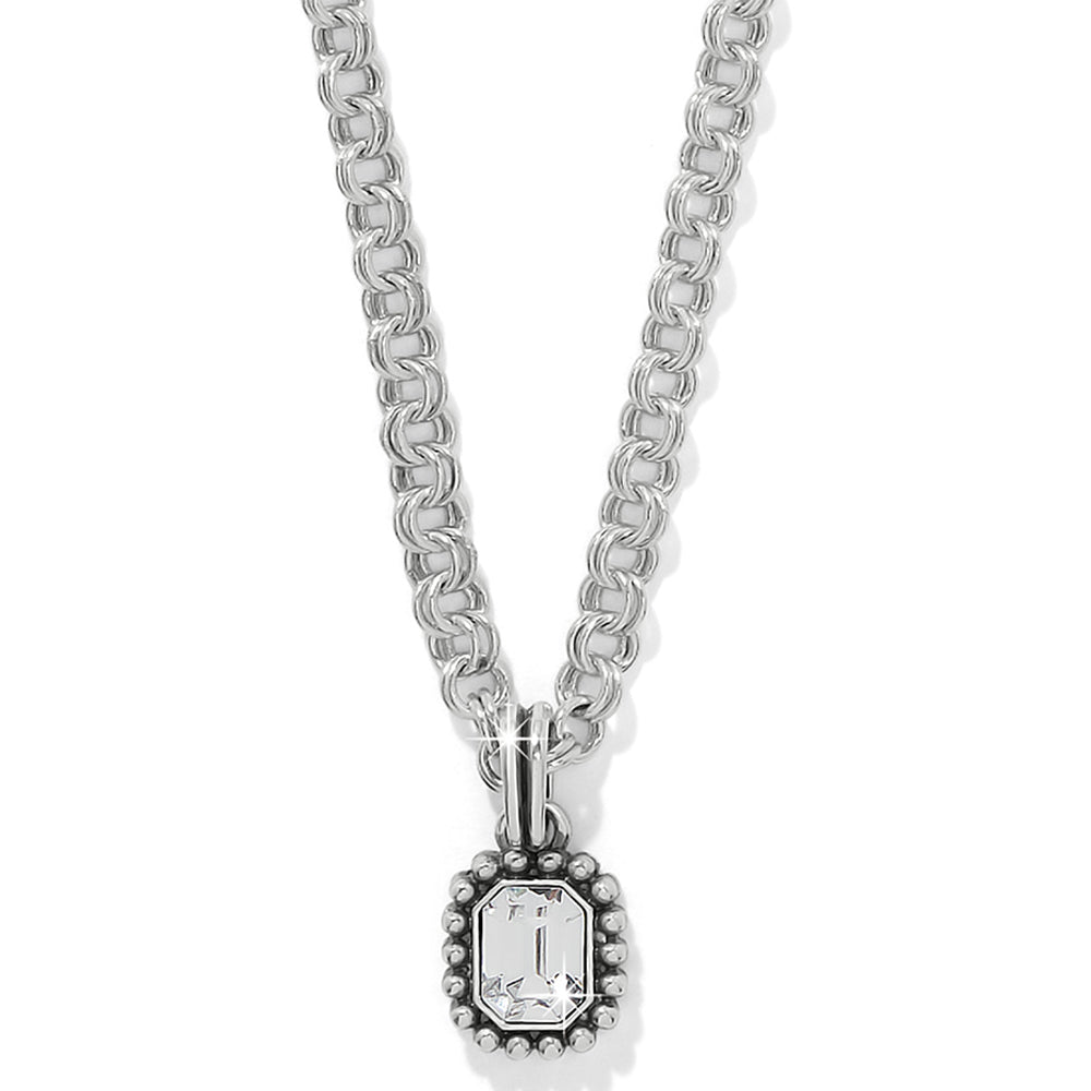 Silver chain necklace with a pendant on a white background