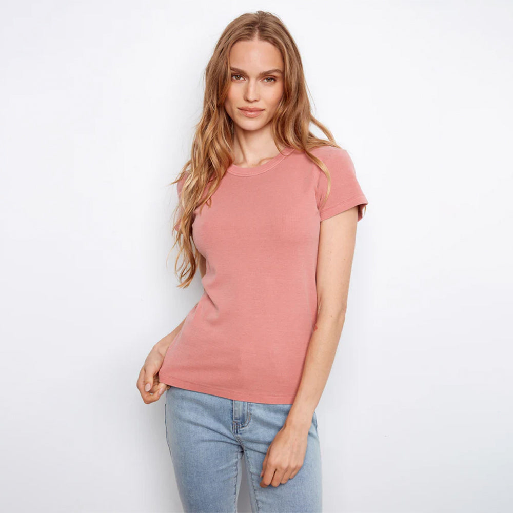 Woman wearing pink shirt on white background