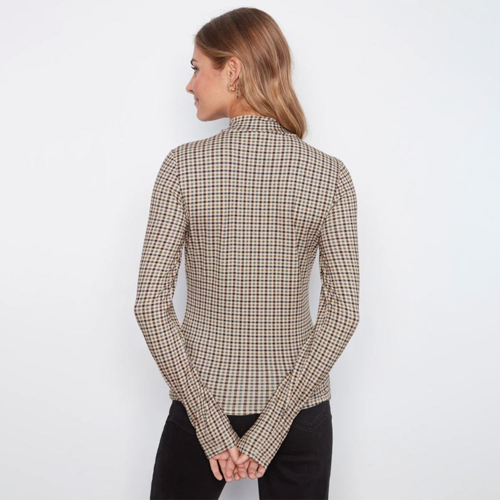 A woman shown from the back wearing a beige and black checkered long-sleeve mock neck top, paired with black pants, against a plain white background.