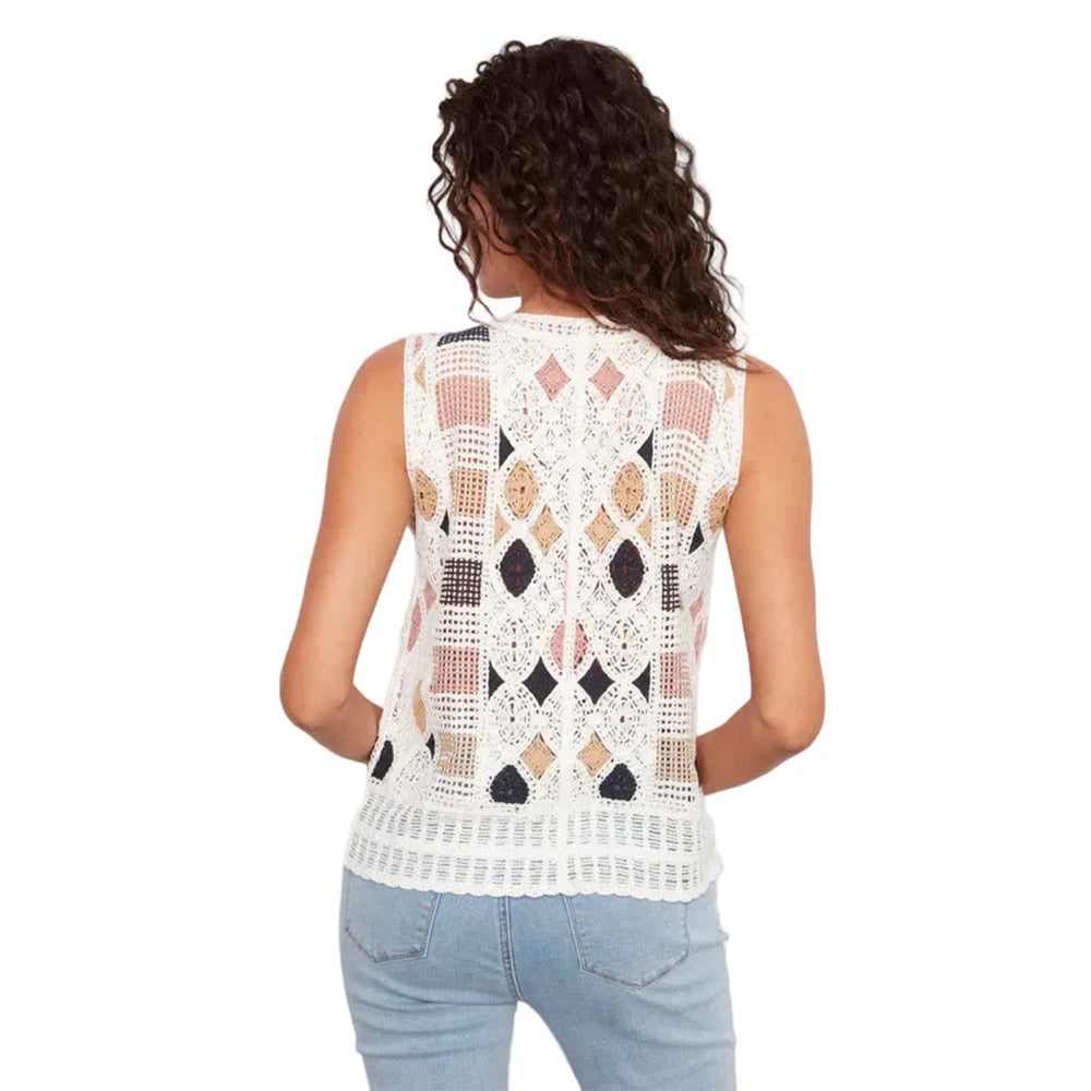 Woman wearing a sleeveless crochet top with geometric pattern on a white background