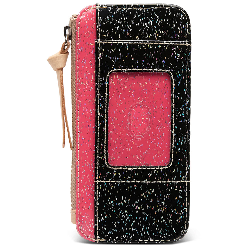 A zip-around wallet with a black and pink speckled exterior, a bright pink window panel, and a beige zipper pull, shown on a white background.