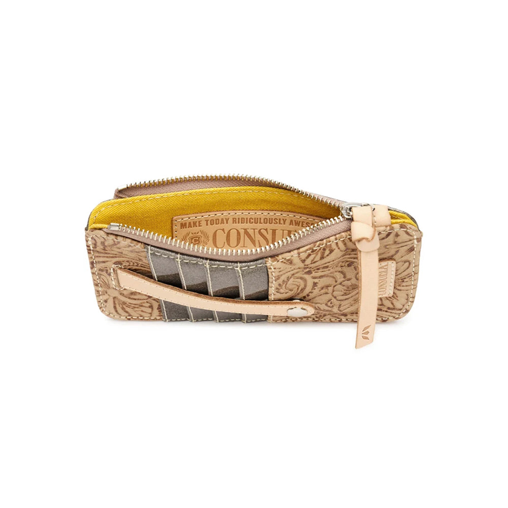 A small zippered pouch with a tan and brown embossed pattern exterior, a bright yellow interior lining, and a light beige leather zipper pull, shown on a plain white background.