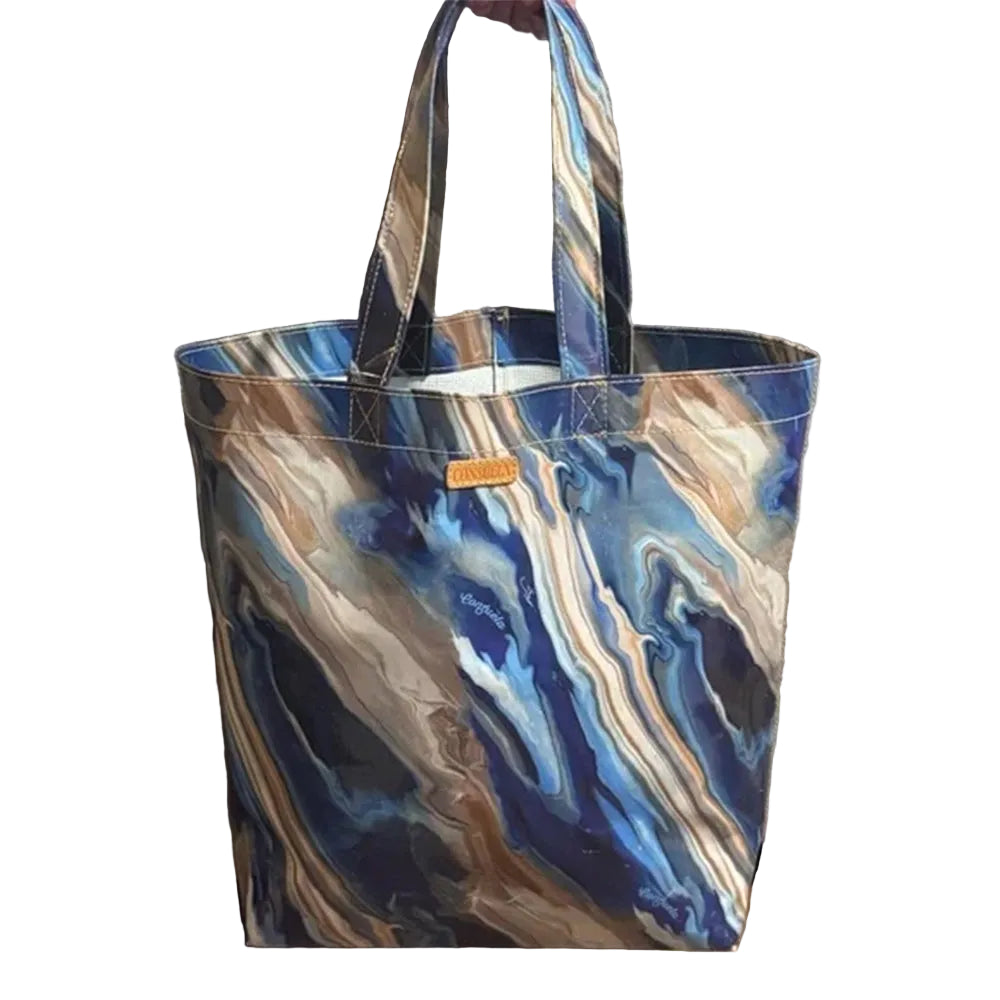 Marbled patterned tote bag with a visible brand logo against a neutral background