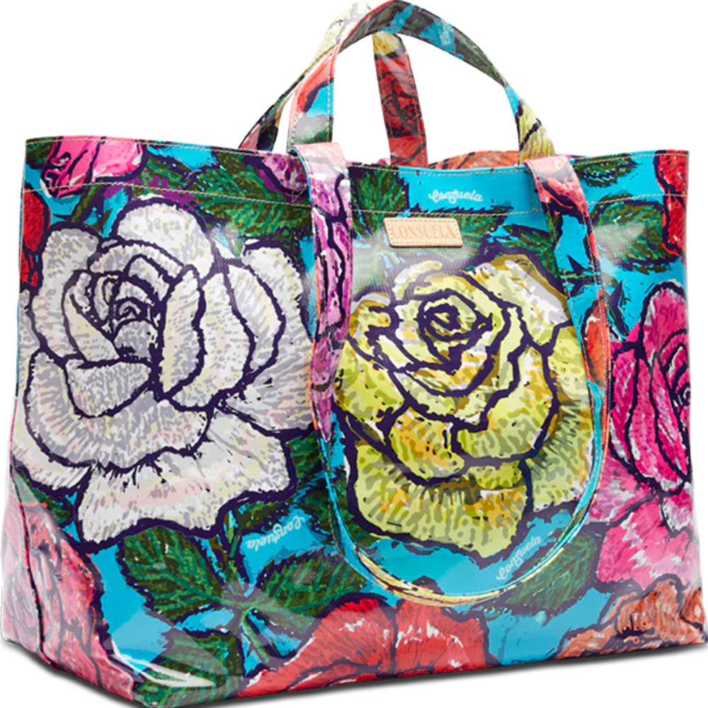 Colorful tote bag with floral design and clear pocket on a white background