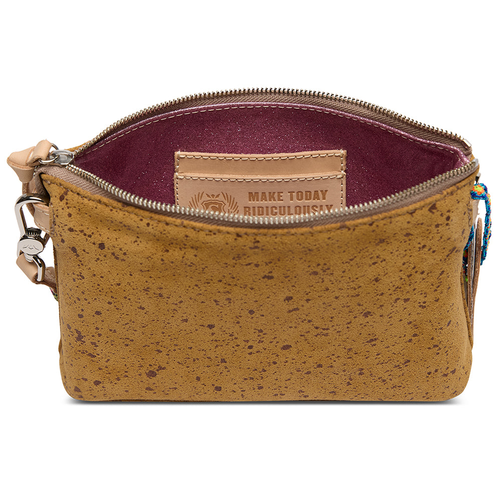 Brown cork handbag with a visible brand tag on a white background