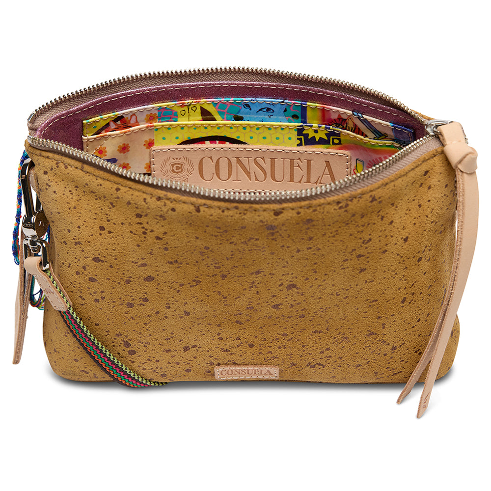 Cork handbag with colorful interior and visible 'Consuela' branding on a white background