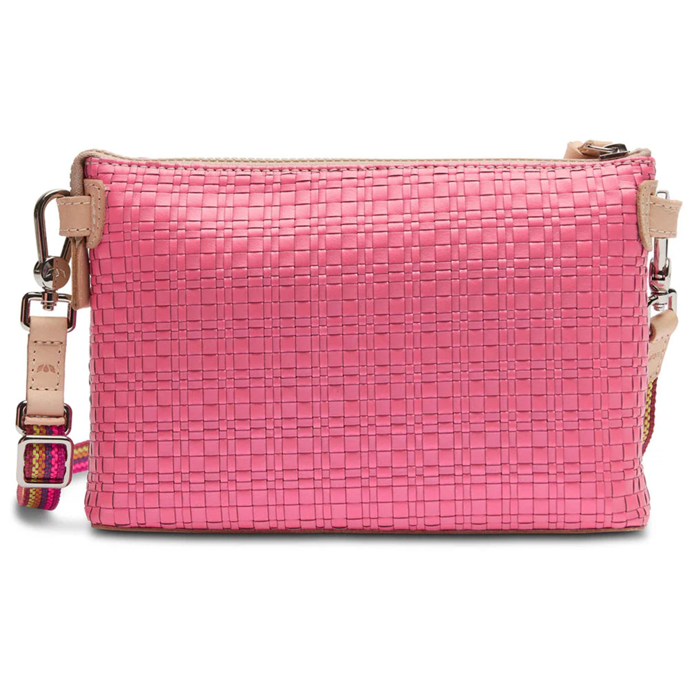Pink woven handbag with a strap on a white background