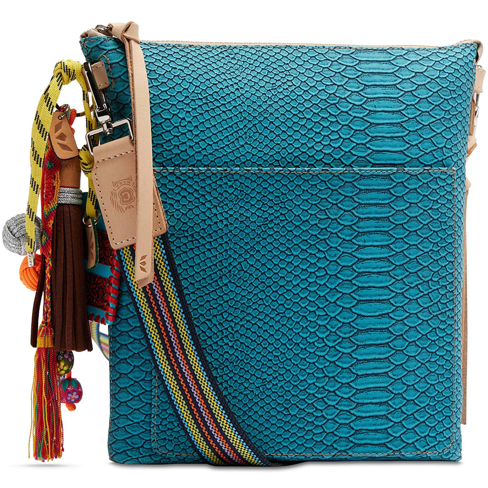 Blue textured handbag with colorful tassels on a white background