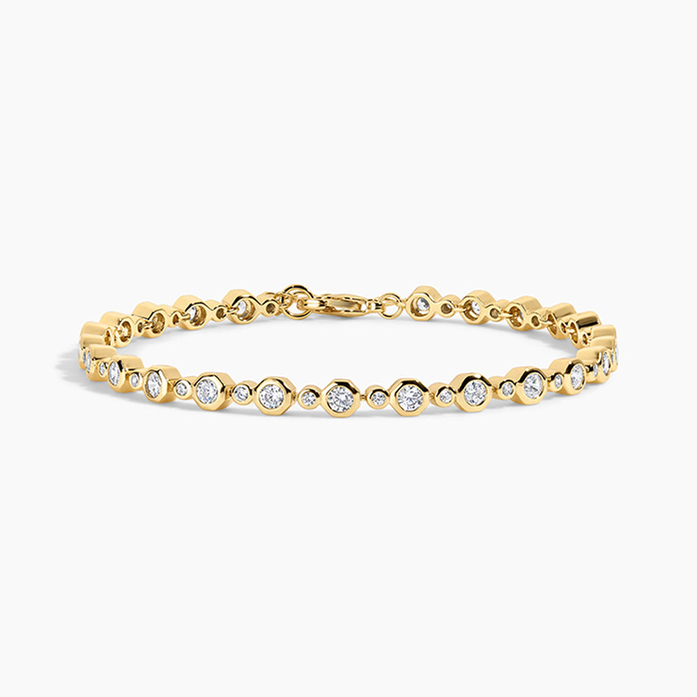 gold bracelet on white background