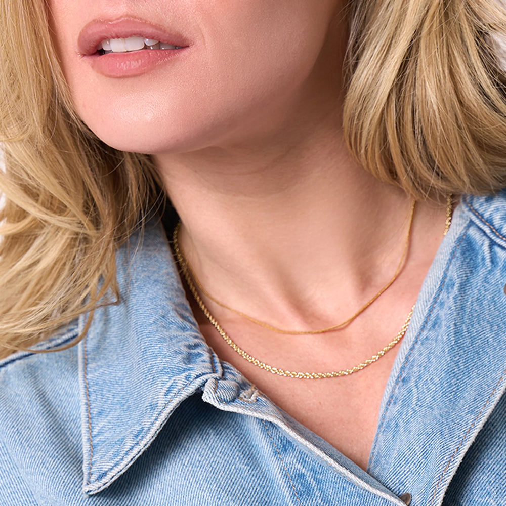 woman wearing double chain necklace
